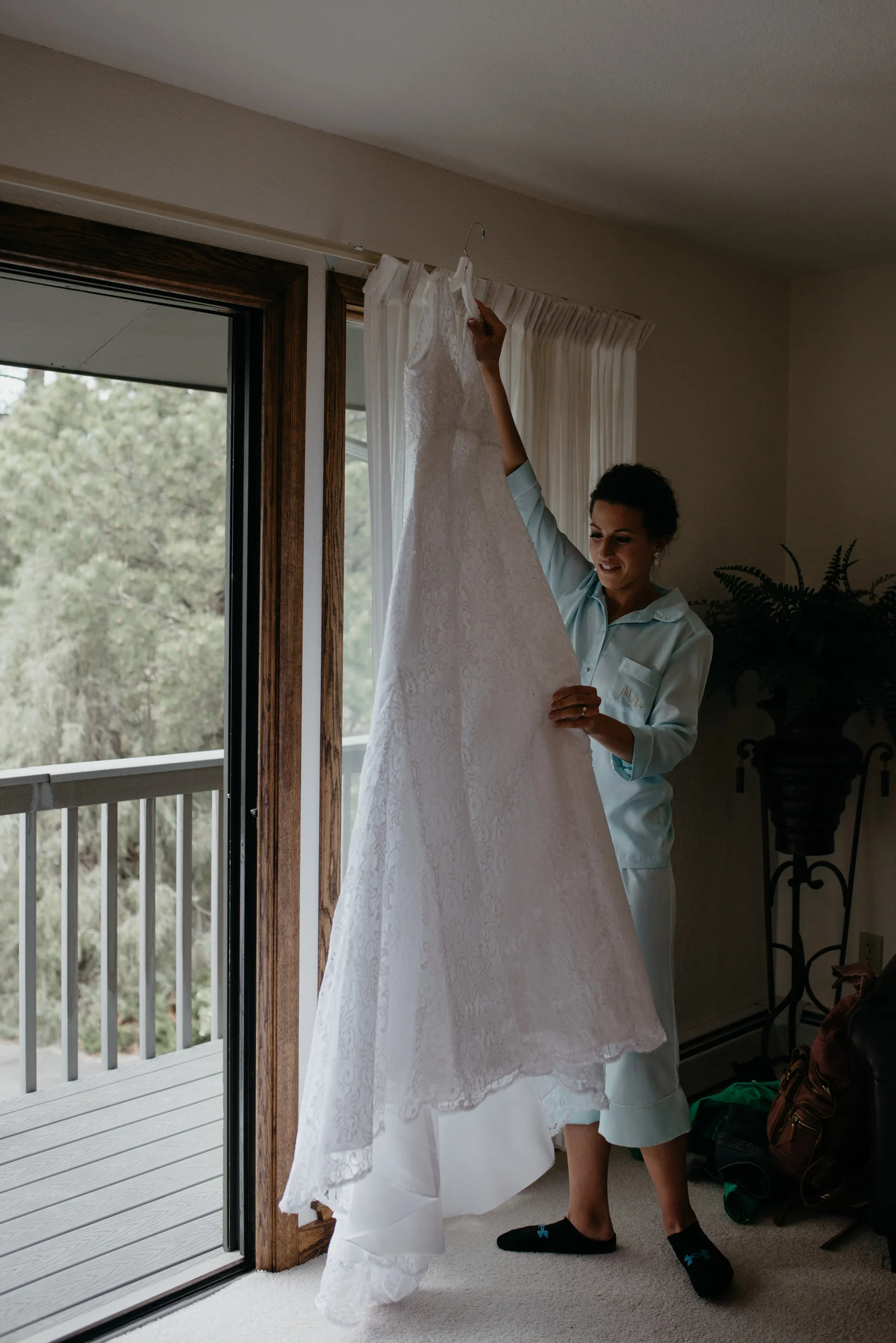  Bride getting dress on. 3M Curve, Rocky Mountain National Park elopement. 