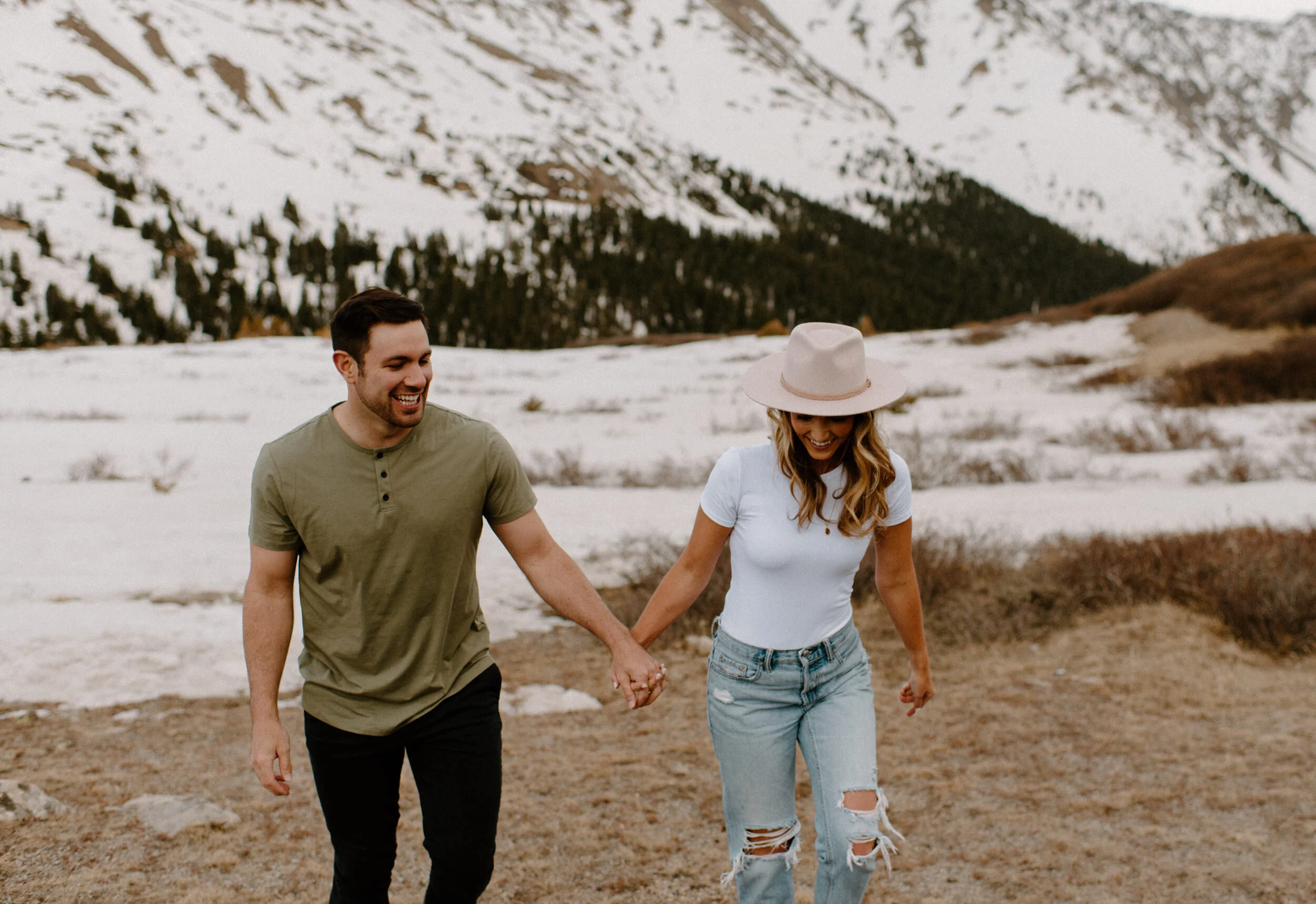  Loveland Pass engagement session in Colorado. Colorado wedding and elopement photographer, Alyssa Carpenter. Colorado wedding photography. Colorado adventure engagement session photographer. Mountain engagement session. Casual engagement session outfit ideas. Save that date ideas. 