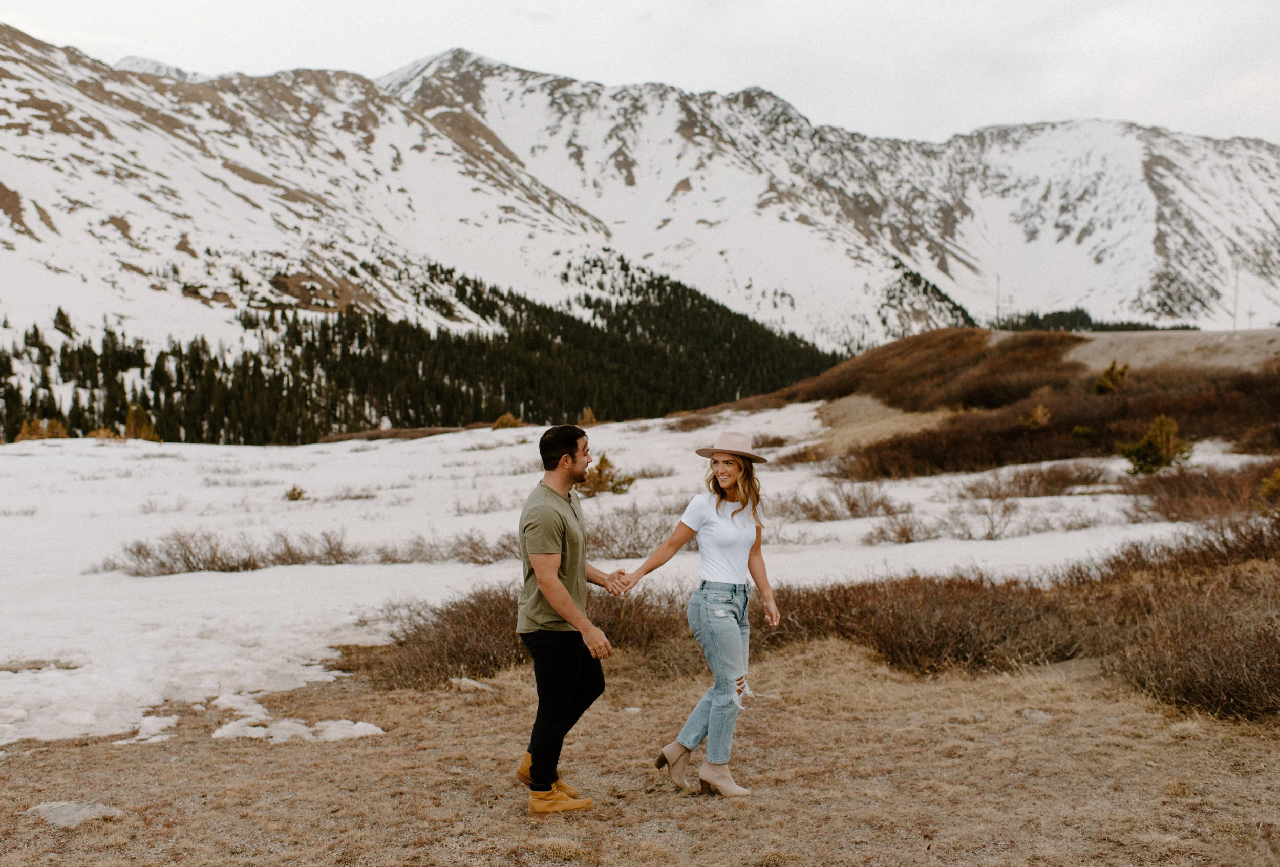  Loveland Pass engagement session in Colorado. Colorado wedding and elopement photographer, Alyssa Carpenter. Colorado wedding photography. Colorado adventure engagement session photographer. Mountain engagement session. Casual engagement session outfit ideas. Colorado engagement photos.  