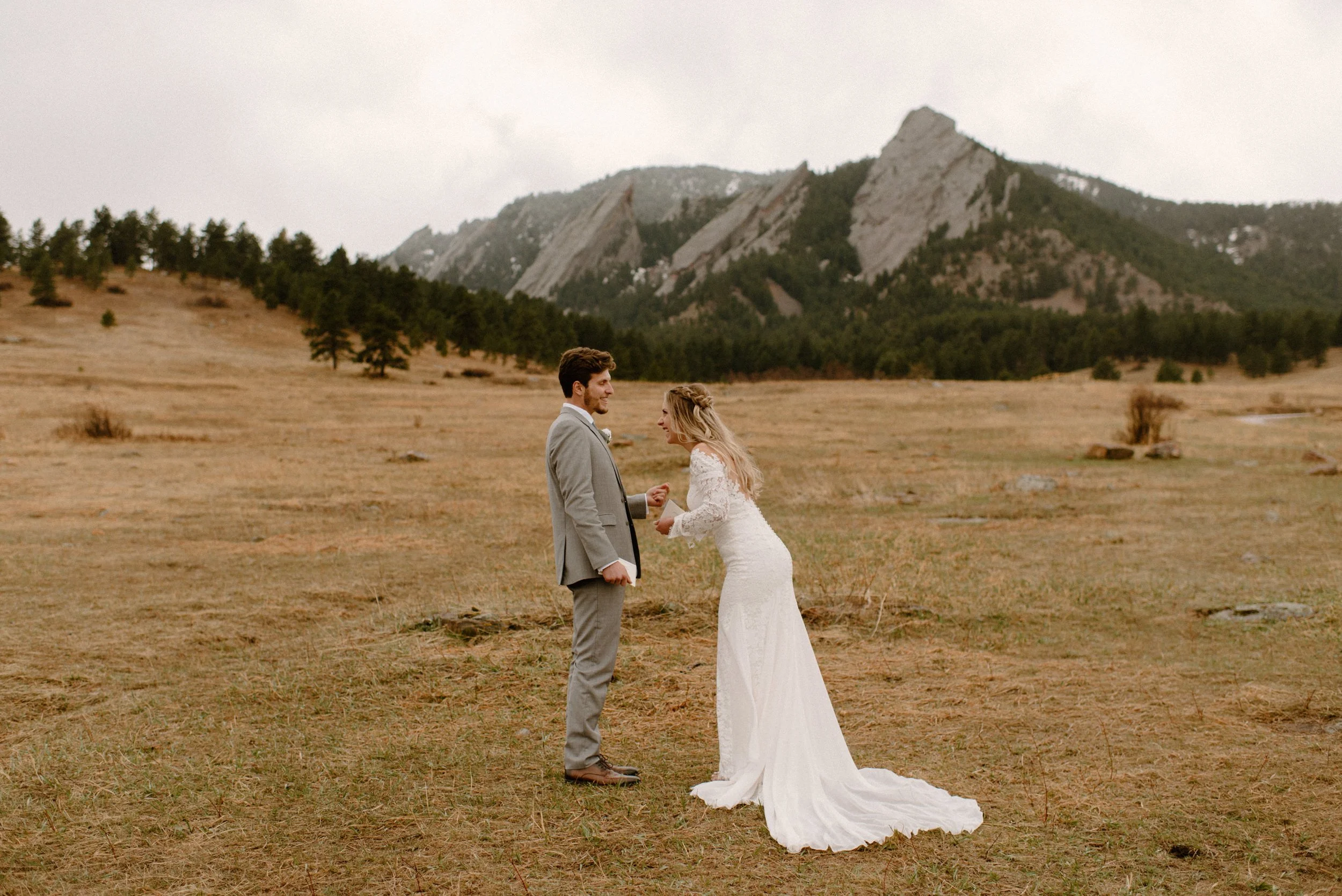  Colorado elopement in Boulder, Colorado at the Flatirons near  Chautauqua Park. Bride and groom exchanging wedding vows.  
