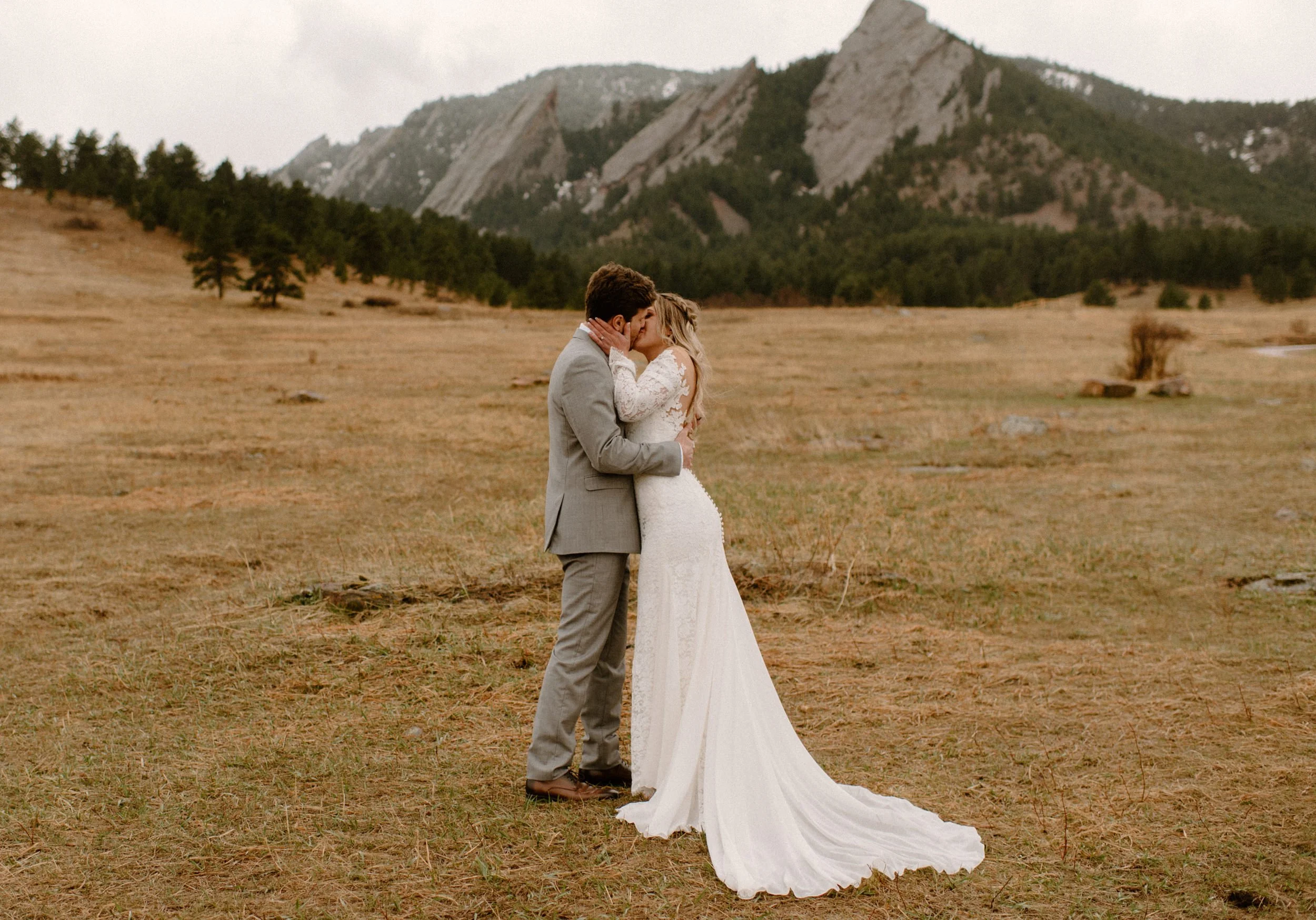  Colorado elopement in Boulder, Colorado at the Flatirons near  Chautauqua Park. Bride and groom first kiss  