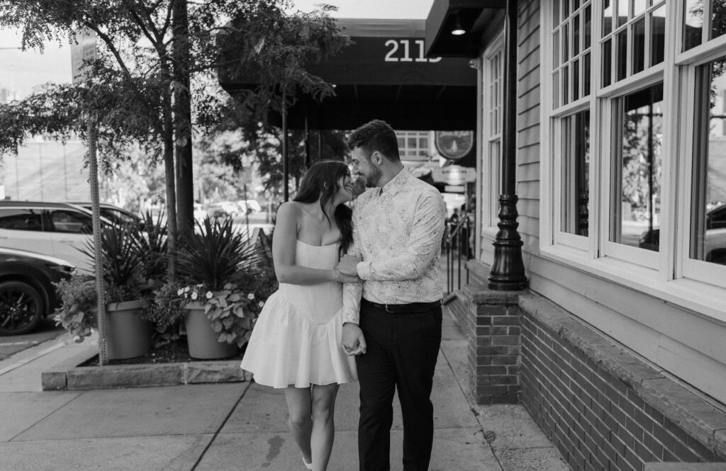 Couple laughing on Pearl Street during engagement session