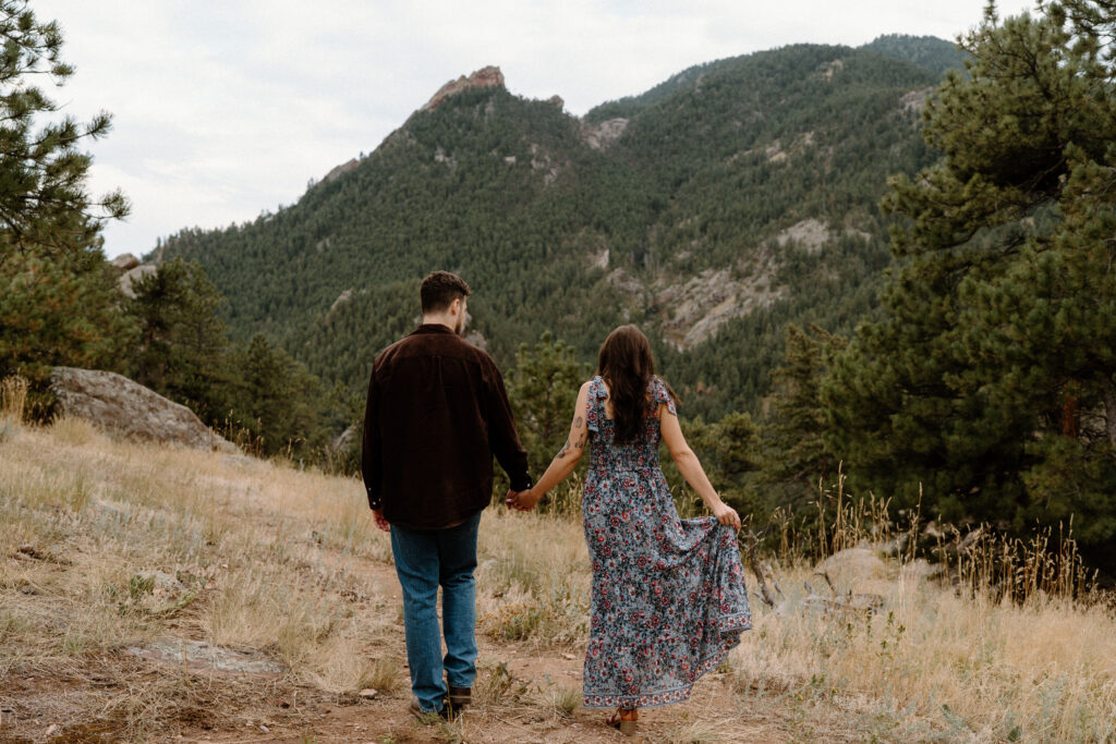 Couple hiking in Boulder, CO during an engagement session