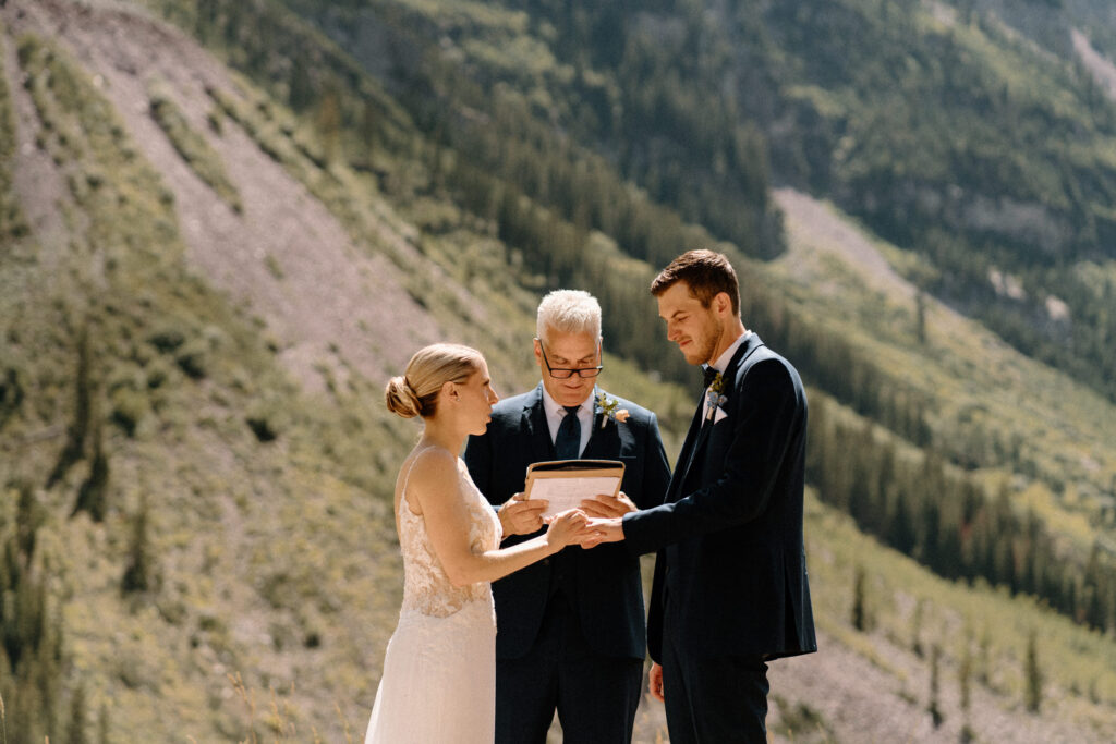 Bride saying vows during elopement ceremony at maroon bells