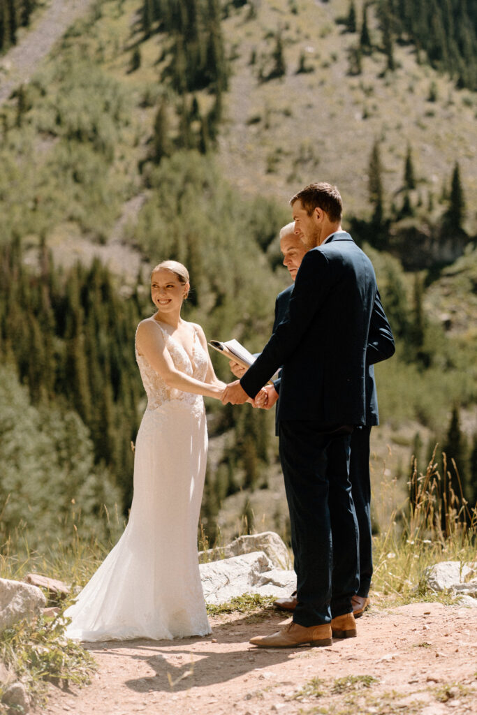 Bride smiling during an elopement ceremony at Maroon Bells