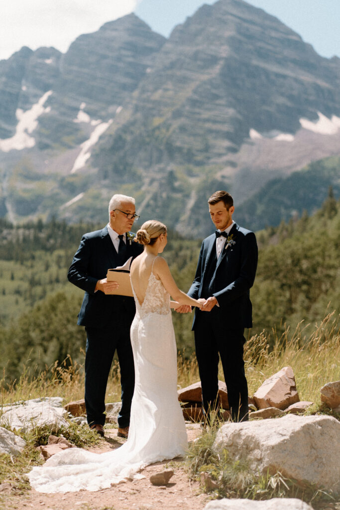 Groom smiling during elopement ceremony at Maroon Bells