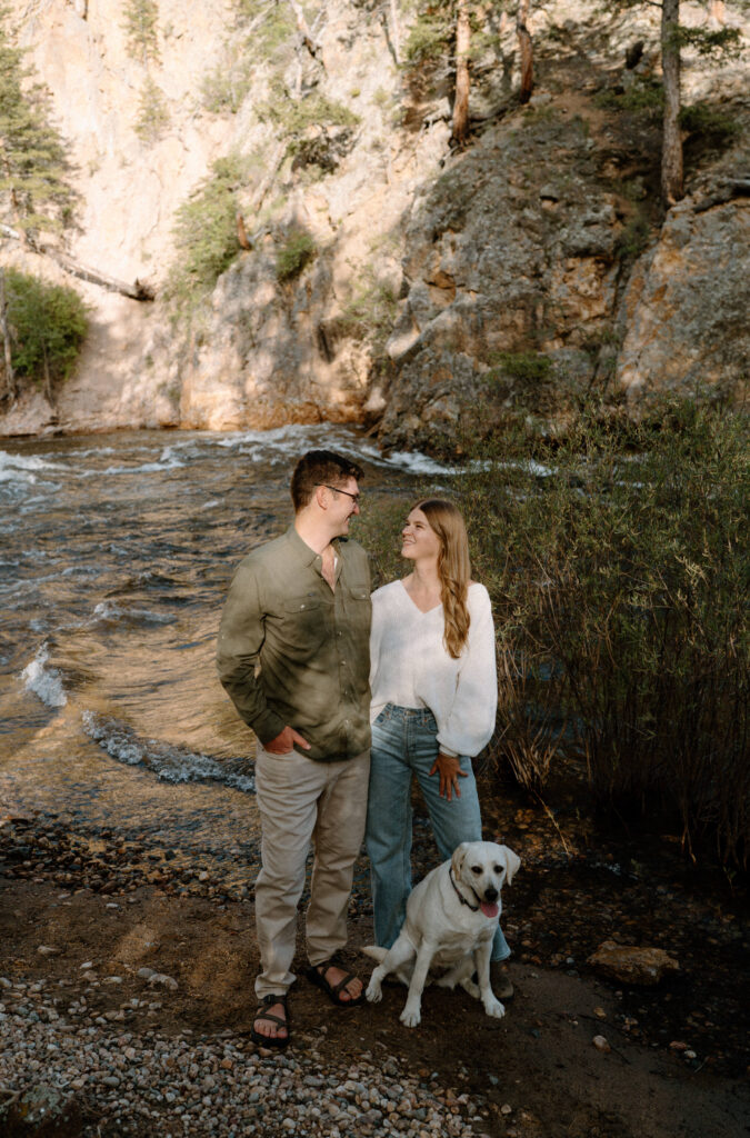 Couple smiling at each other during engagement session at Poudre Canyon