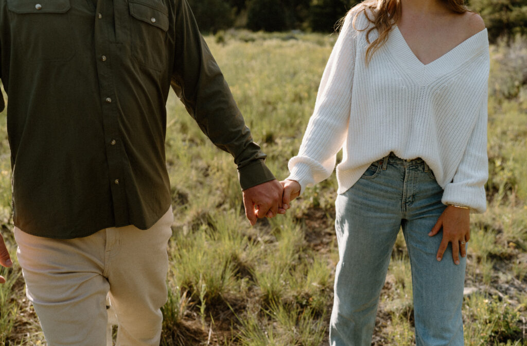 Close-up of couple's outfits during an engagement session at Poudre Canyon