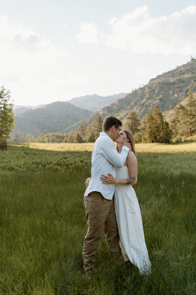 Couple kissing in Poudre Canyon during engagement session
