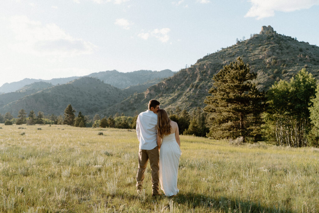 Couple admiring the view of Poudre Canyon during engagement session