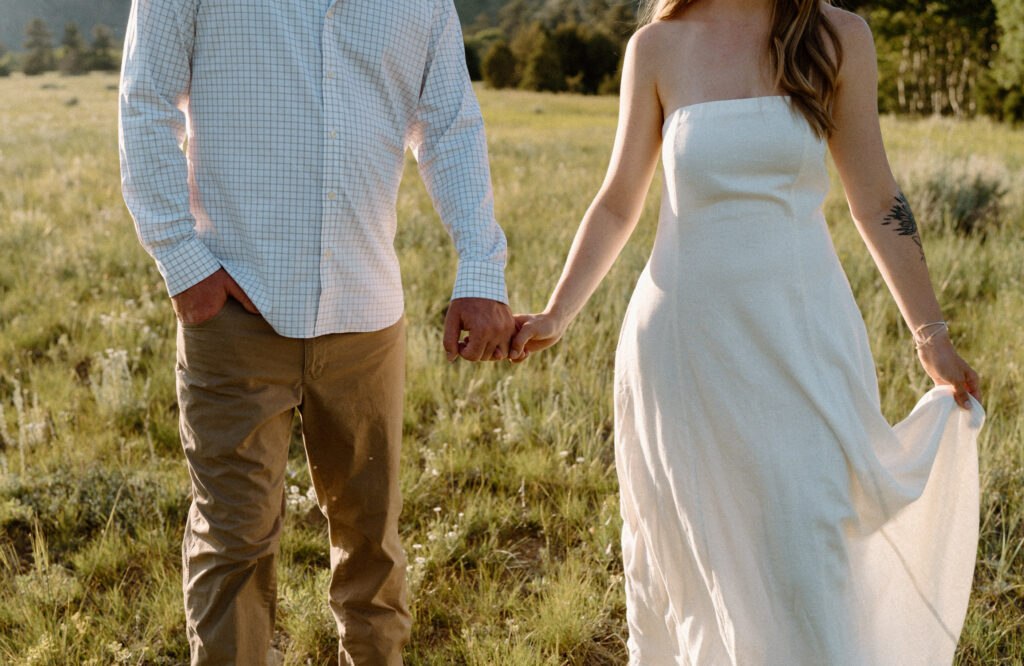Close-up of couple's outfits at Poudre Canyon during engagement session