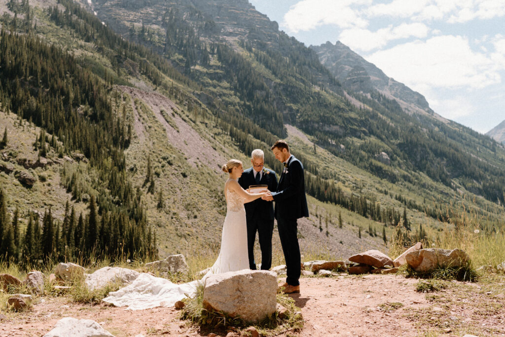 Bride saying vows at Maroon Bells during an elopement ceremony