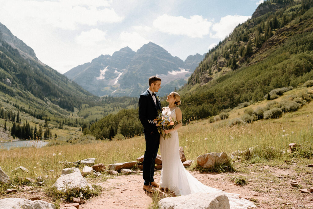 Bride and groom smiling at each other during an elopement at Maroon Bells