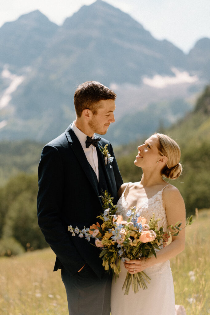 Bride and groom smiling during an elopement at Maroon Bells