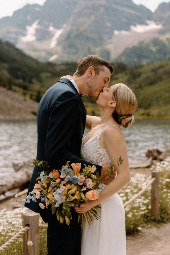 Bride and groom kissing during an elopement at Maroon Bells