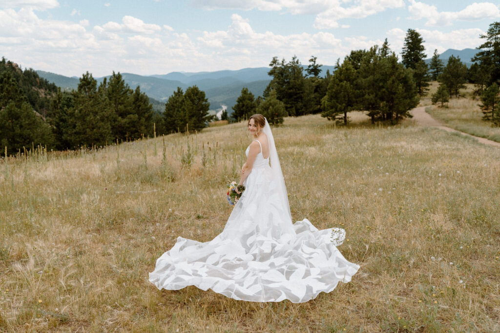 Bride smiling at the camera on wedding day at Mt. Falcon