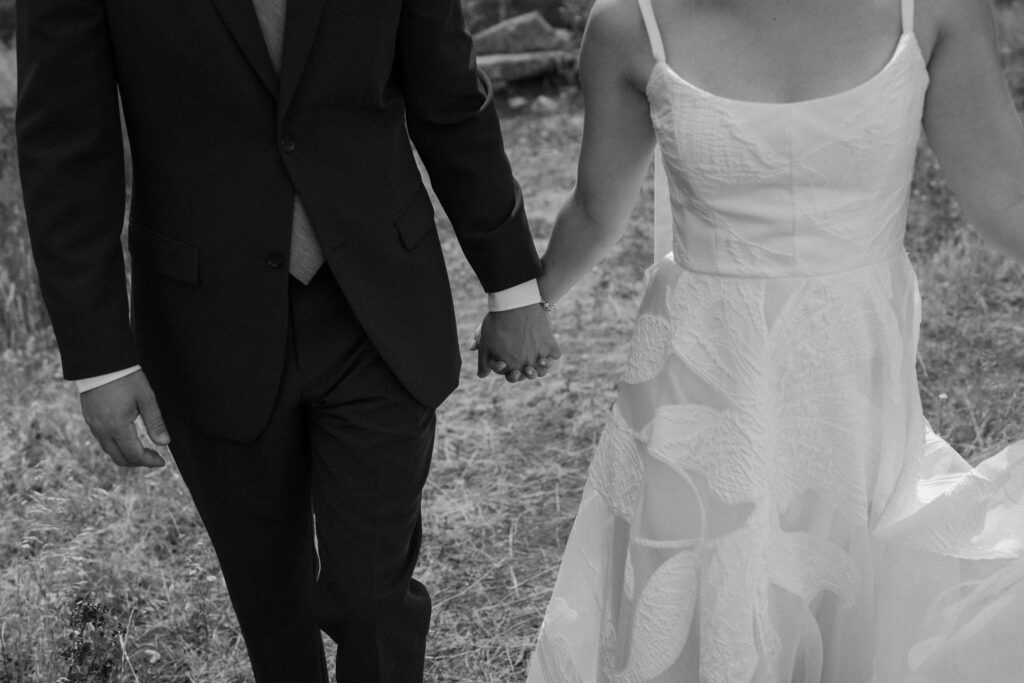 Close-up of bride and groom's outfits on wedding day at Mt. Falcon