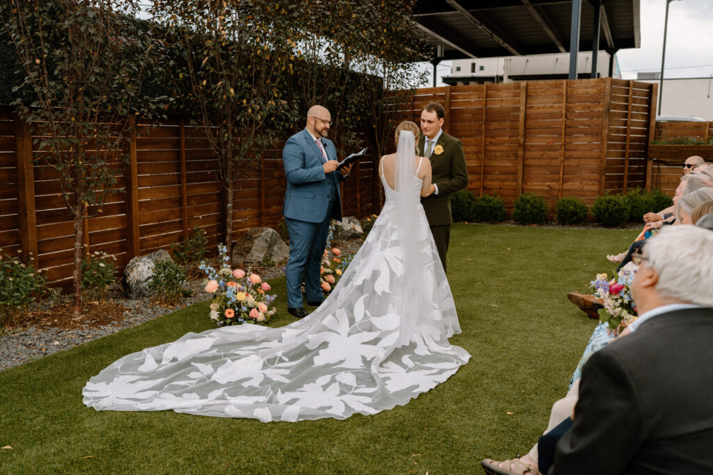 Groom smiling during wedding ceremony at Mountain Crust