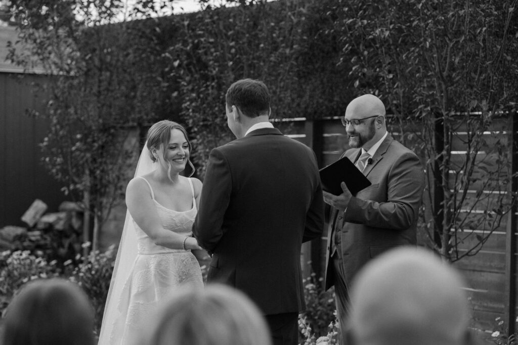 Bride laughing during wedding ceremony at Mountain Crust