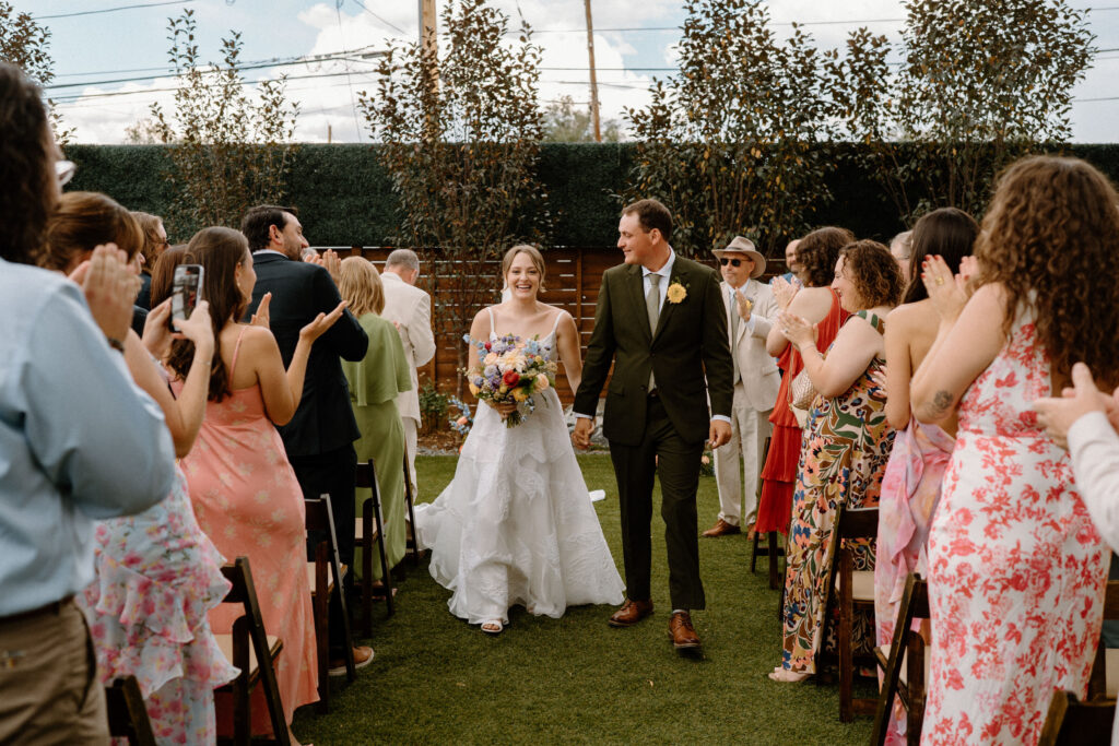 Bride and groom walking down the aisle after ceremony at Mountain Crust 