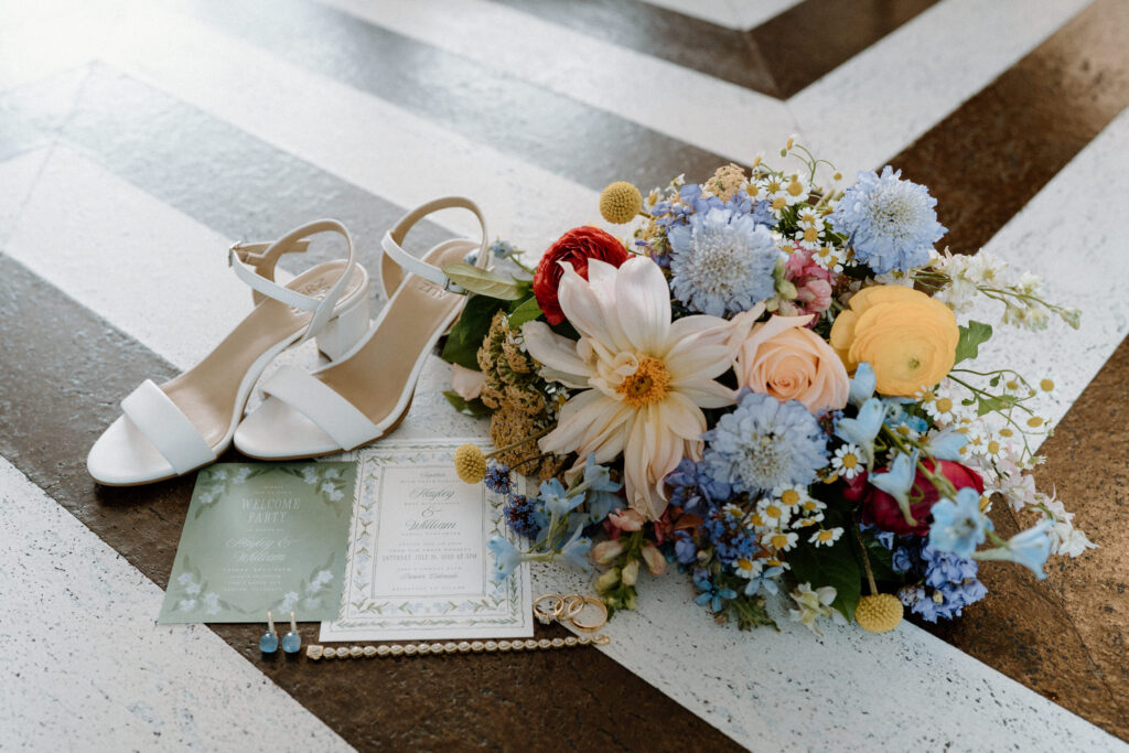 Flat lay of couple's details at the Maven Hotel in Denver on wedding day