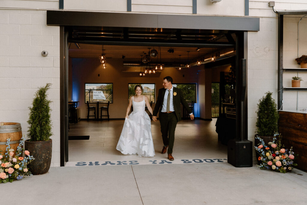 Bride and groom walking into dinner during wedding at Mountain Crust