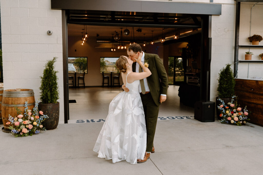 Bride and groom kissing on wedding day at Mountain Crust