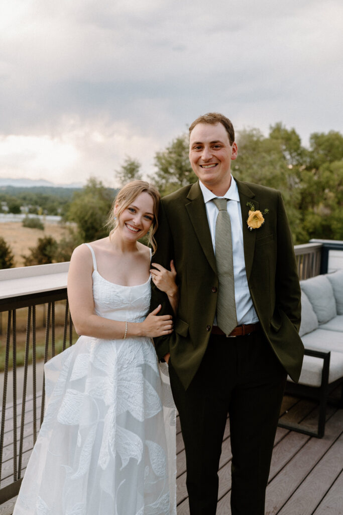 Bride and groom smiling at the camera on wedding day at Mountain Crust