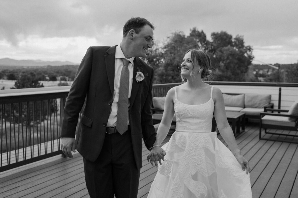Bride and groom walking on the patio on wedding day at Mountain Crust