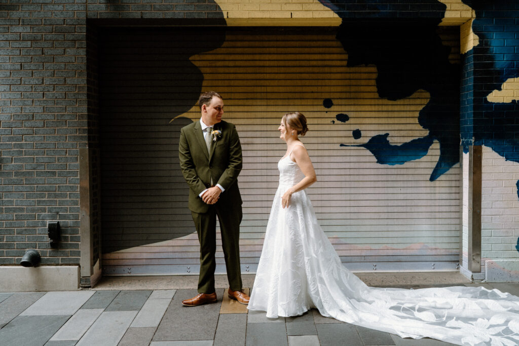 Groom turning around to see bride during first look in Denver
