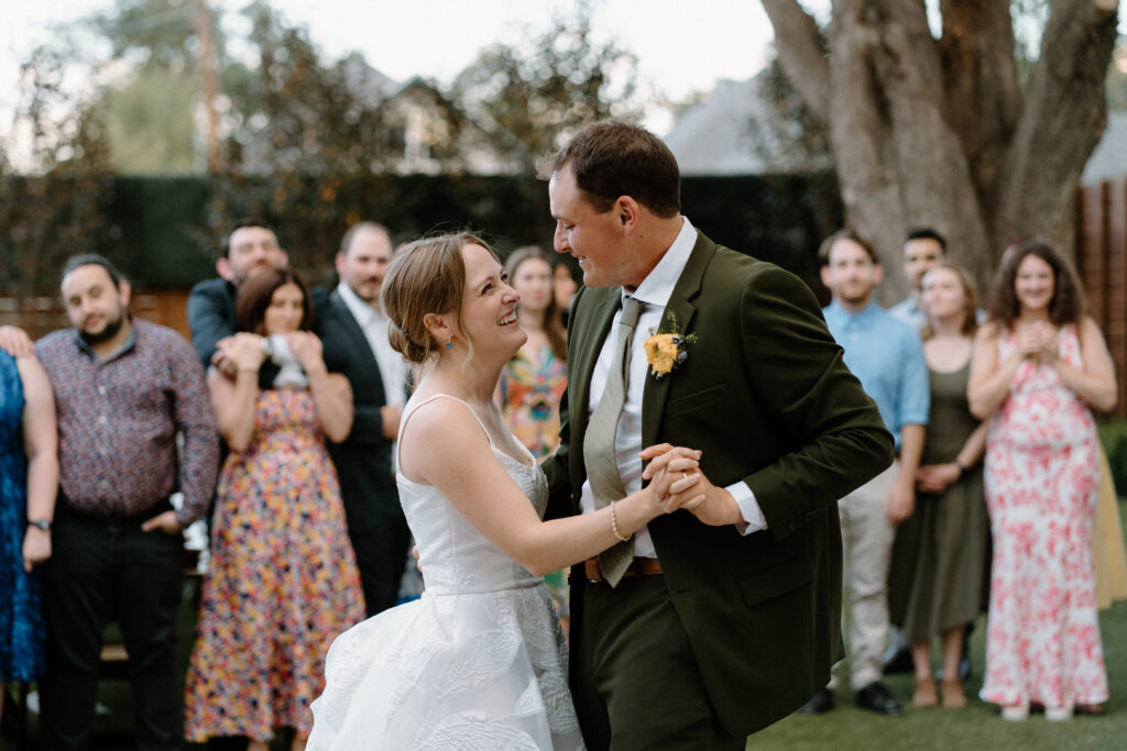Bride and groom laughing during first dance at Mountain Crust