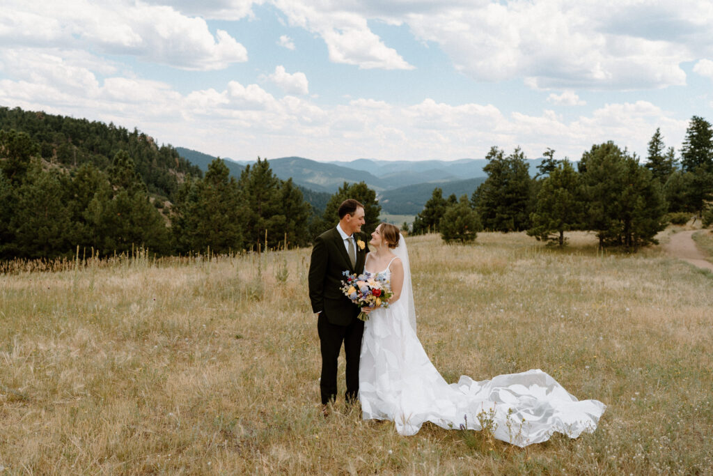 Bride and groom looking at each other on wedding day at Mt. Falcon 