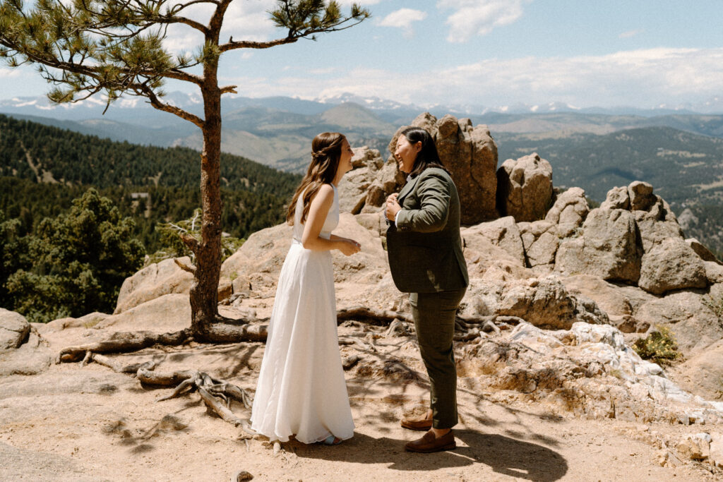 Couple laughing during vows on wedding day at Sunrise Amphitheater 