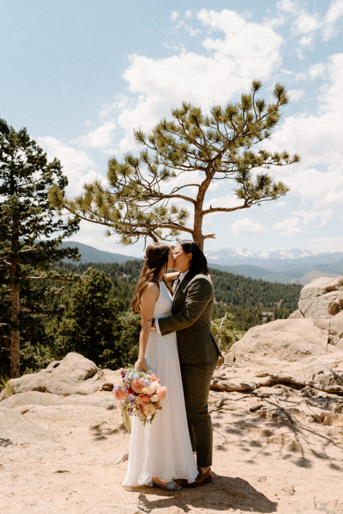 Couple kissing at Sunrise Amphitheater on wedding day