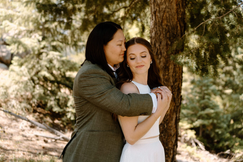 Couple hugging on wedding day at Sunrise Amphitheater 