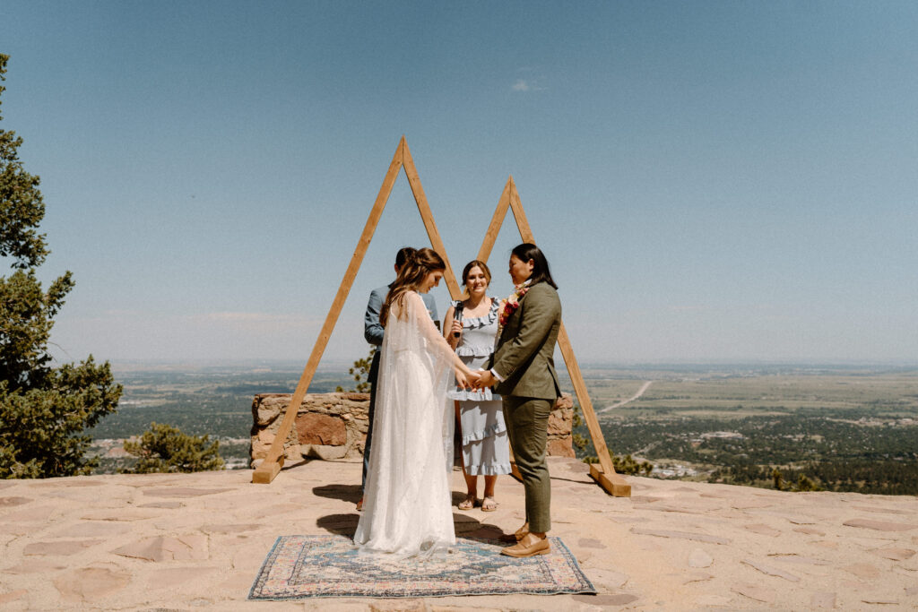 Couple standing at alter on wedding day at Sunrise Amphitheater 