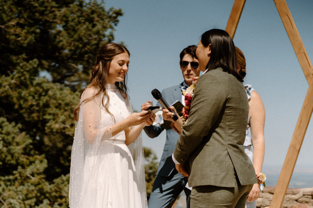 Bride saying vows during ceremony at Sunrise Amphitheater 