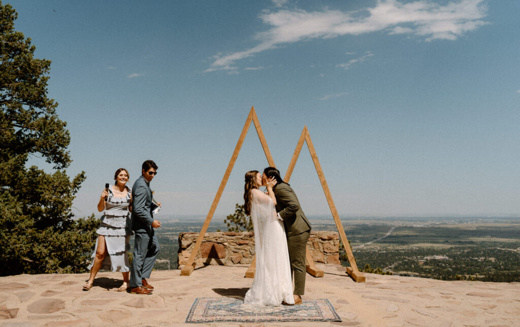 Couple kissing during ceremony at Sunrise Amphitheater 