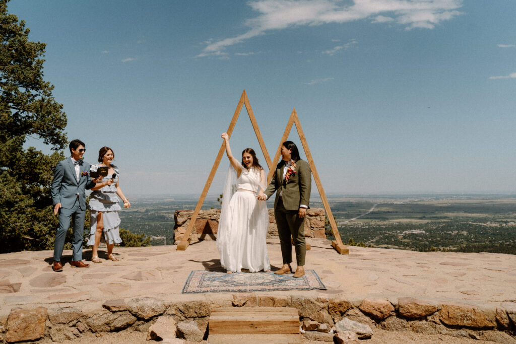 Couple cheering after ceremony at Sunrise Amphitheater 