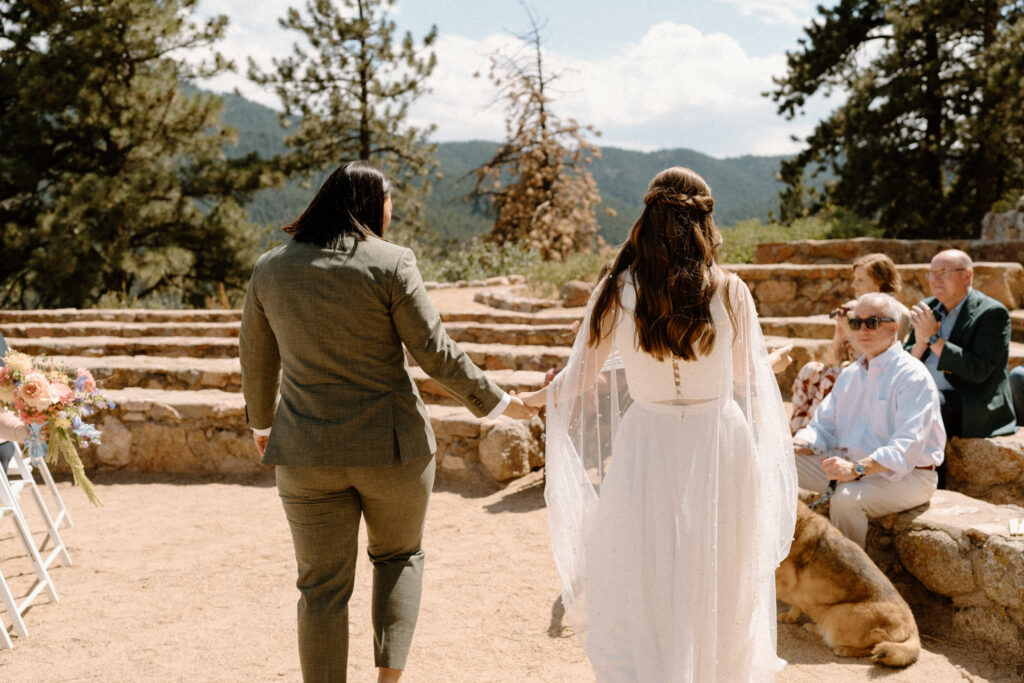 Couple leaving the alter on wedding day at Sunrise Amphitheater 