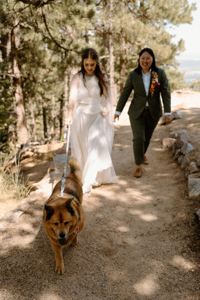 Couple walking their dog after ceremony at Sunrise Amphitheater 