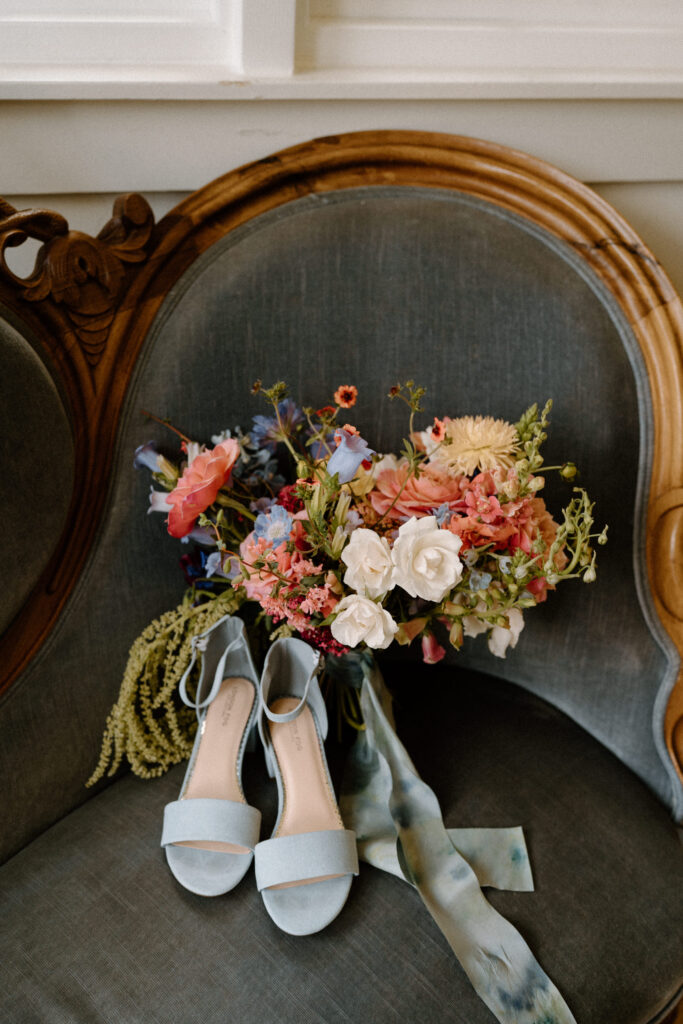 Wedding bouquet and shoes from a wedding at Sunrise Amphitheater 