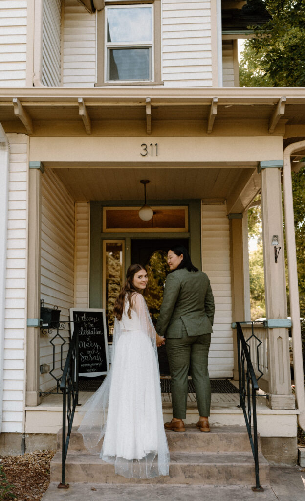 Couple standing on steps on wedding day