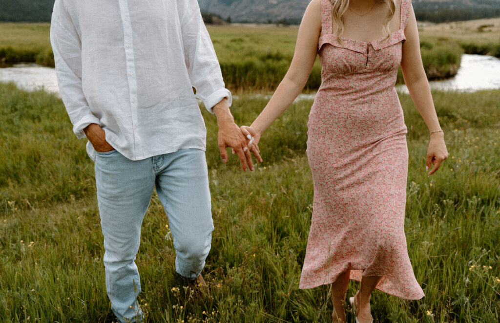 Close-up of couple's outfits during an engagement session at Rocky Mountain National Park
