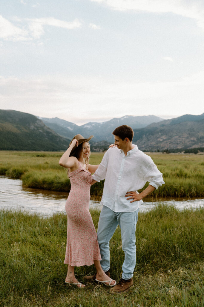 Couple laughing during an engagement session at Rocky Mountain National Park