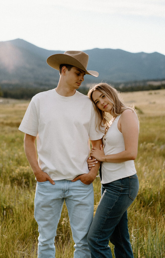 Couple hugging each other during an engagement session at Rocky Mountain National Park