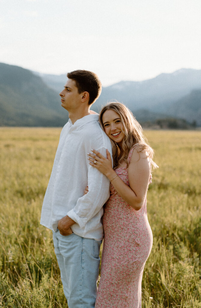 Fiancée hugging fiancé during an engagement session at Rocky Mountain National Park