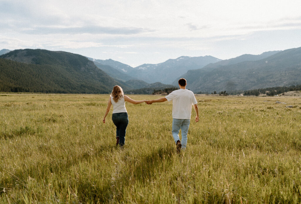 Couple hiking in Rocky Mountain National Park during an engagement session