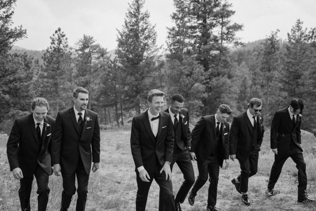 Groom and groomsmen walking on wedding day at Woodlands