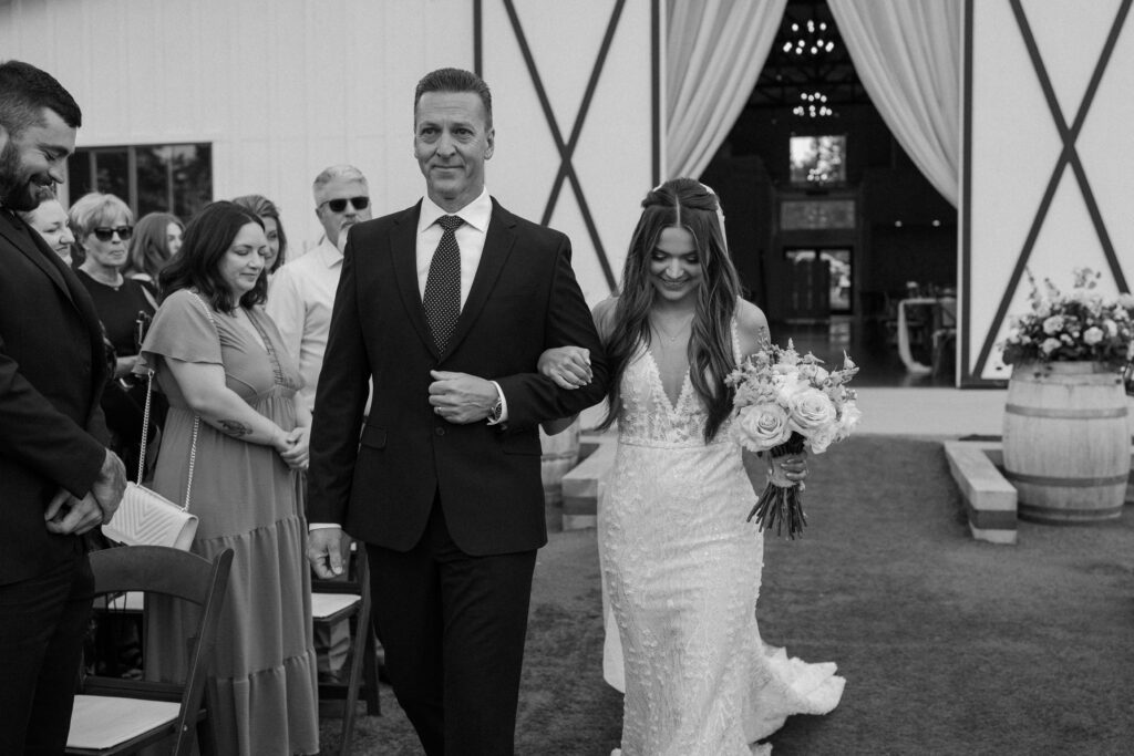 Bride and dad walking down the aisle at Woodlands on wedding day